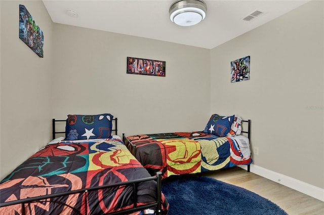188 Ridgemont Ct, Davenport, FL 33896 - bedroom with wood finished floors and baseboards