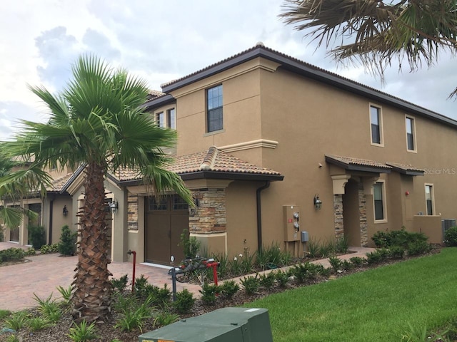 mediterranean / spanish-style house featuring a front lawn