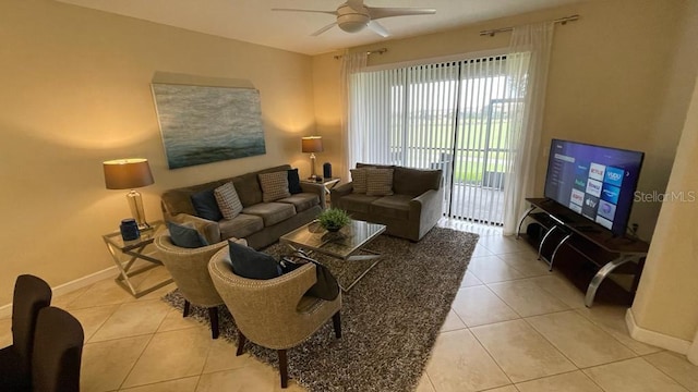 living room featuring ceiling fan and light tile patterned floors