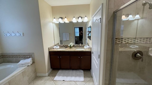 bathroom with tile patterned flooring, vanity, and separate shower and tub