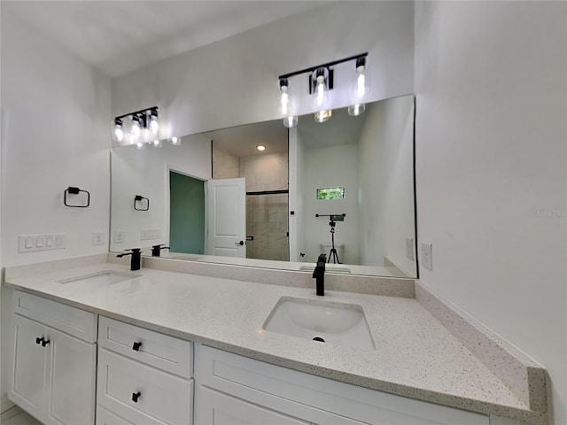 bathroom featuring vanity and an enclosed shower