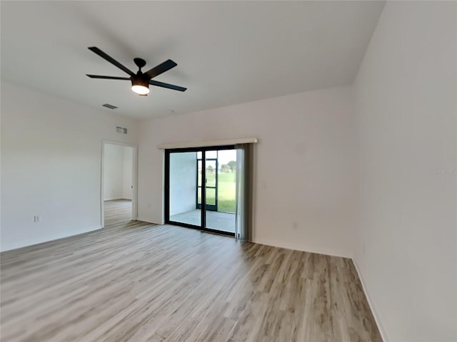 unfurnished room with ceiling fan and light wood-type flooring