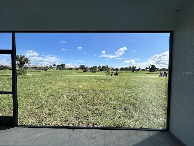 view of yard with a rural view