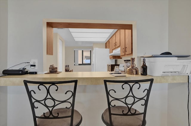 kitchen featuring white fridge