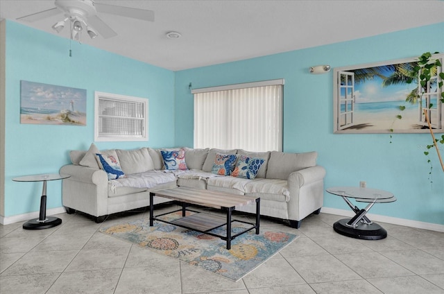 tiled living room featuring ceiling fan