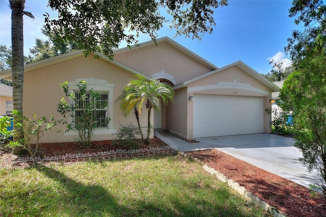 ranch-style house with a garage and a front lawn