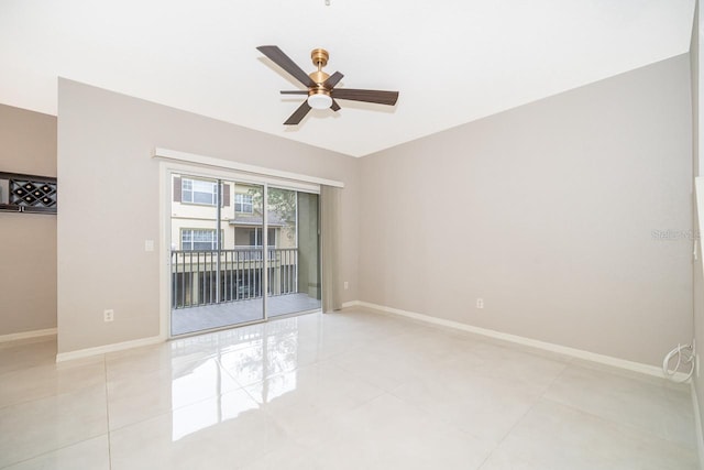 tiled empty room featuring ceiling fan