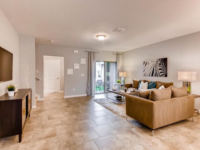 living room with a textured ceiling