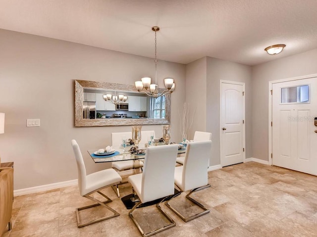 dining room with a notable chandelier