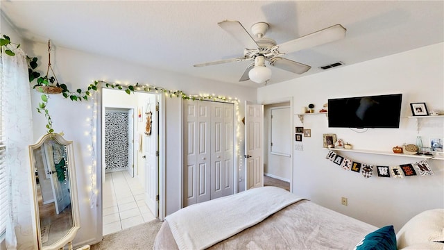 bedroom with light colored carpet and ceiling fan