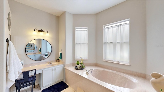 bathroom featuring vanity, tiled bath, and tile patterned floors