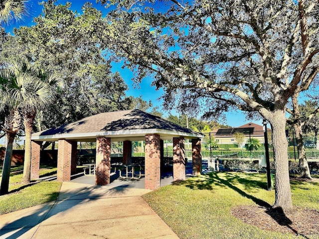 view of home's community featuring a gazebo, a patio, and a lawn