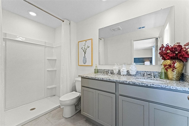 bathroom with tile patterned flooring, vanity, toilet, and a shower with shower curtain