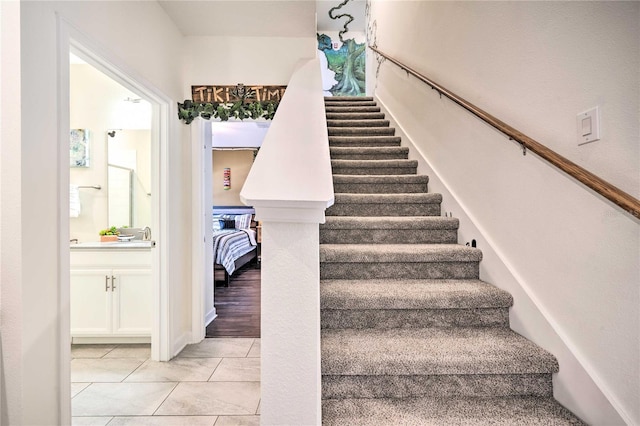 staircase with hardwood / wood-style flooring