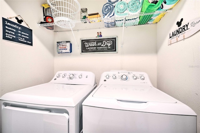 laundry area with separate washer and dryer