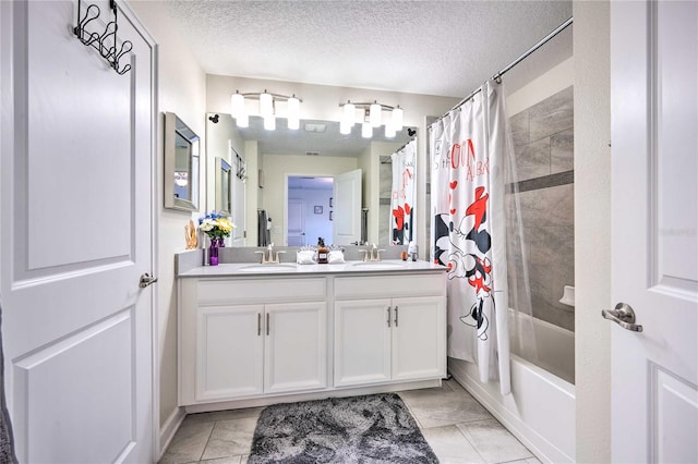 bathroom featuring vanity, tile patterned floors, a textured ceiling, and shower / bath combo