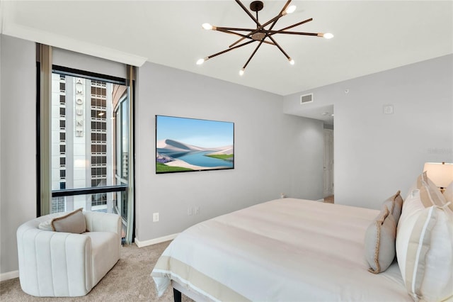 bedroom with an inviting chandelier, baseboards, light colored carpet, and visible vents