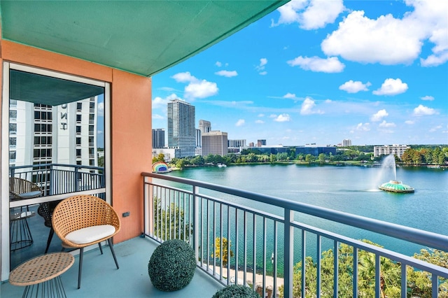 balcony with a view of city and a water view
