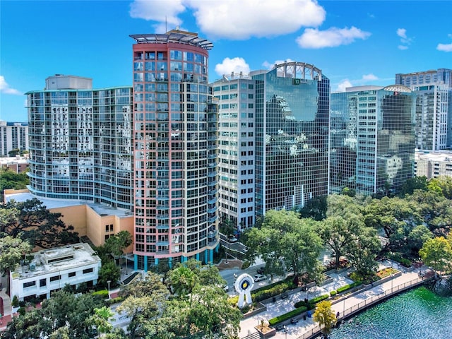 view of building exterior with a view of city and a water view