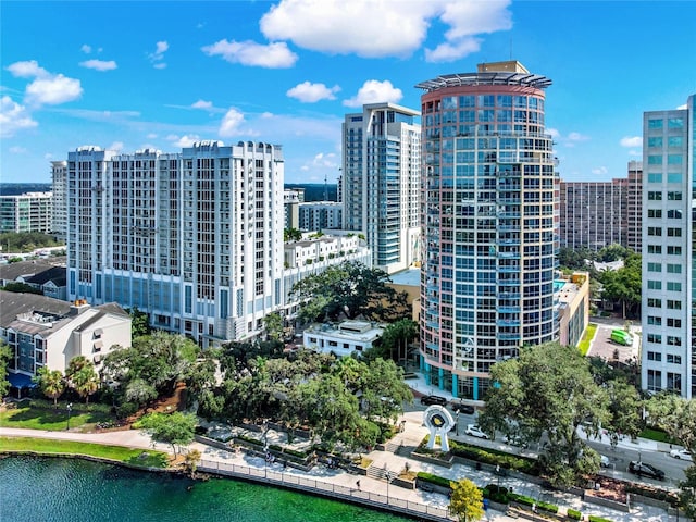exterior space with a water view and a city view