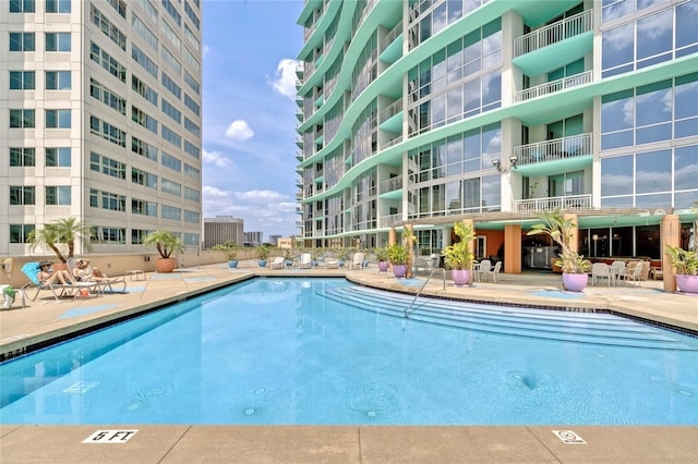 view of pool featuring a patio