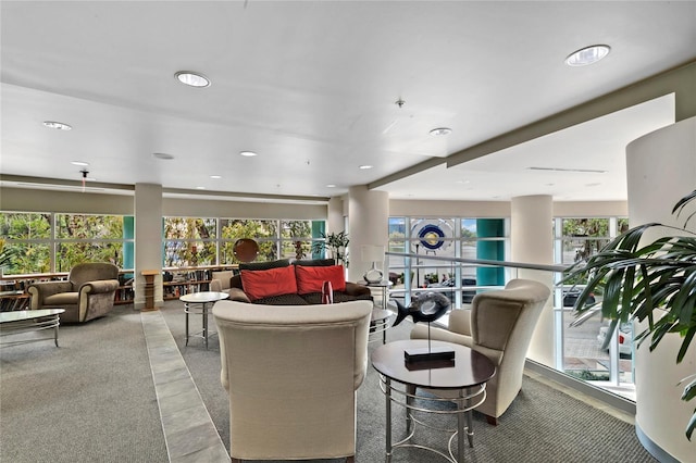 carpeted living room with a healthy amount of sunlight