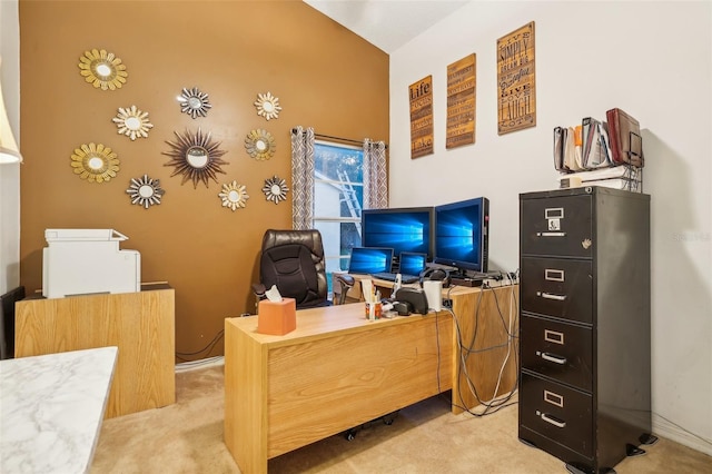 carpeted office with lofted ceiling