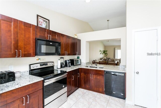 kitchen featuring lofted ceiling, black appliances, sink, light tile patterned floors, and light stone counters