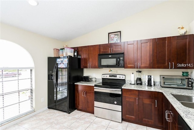 kitchen with black appliances, light stone countertops, lofted ceiling, and light tile patterned floors