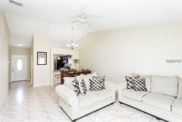 living room featuring light tile patterned floors, ceiling fan with notable chandelier, and lofted ceiling