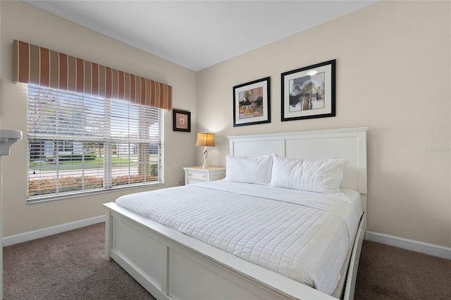 bedroom with dark carpet