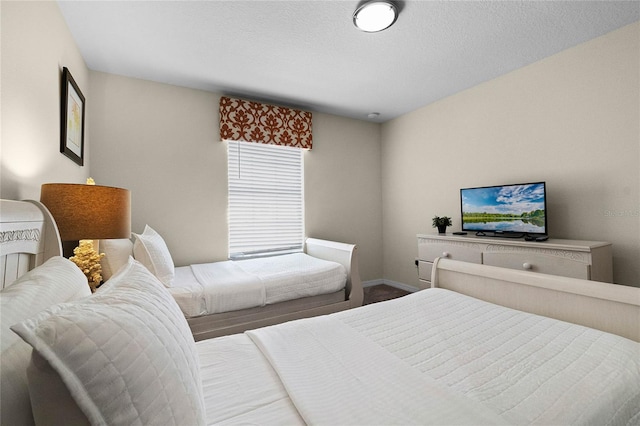 bedroom featuring a textured ceiling