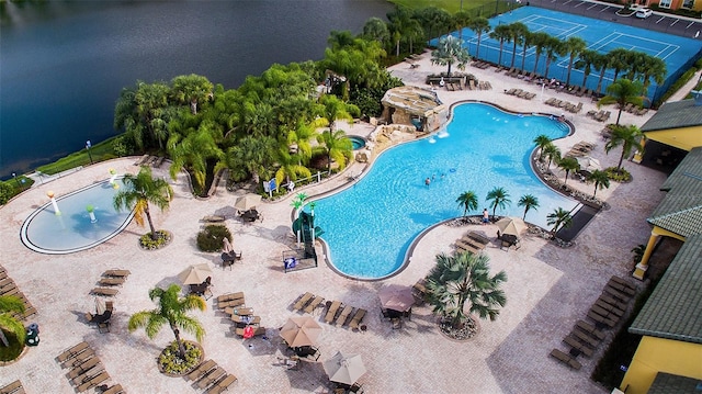 birds eye view of property with a water view