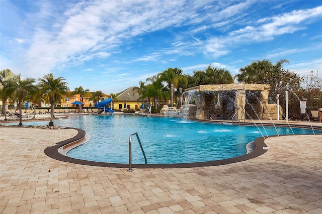 8947 Bismarck Palm Rd, Kissimmee, FL 34747 - community pool featuring a water slide and a patio area