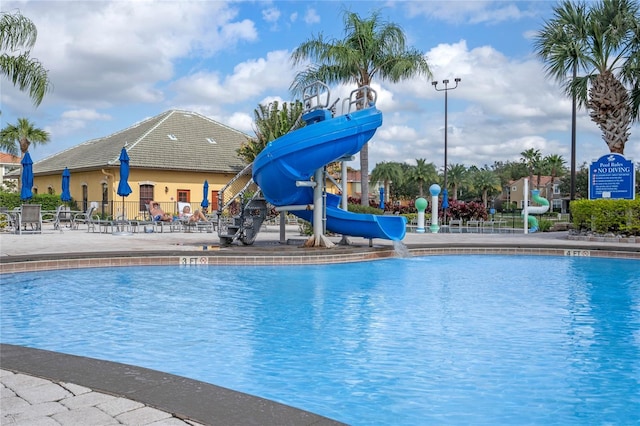 view of pool featuring a water slide