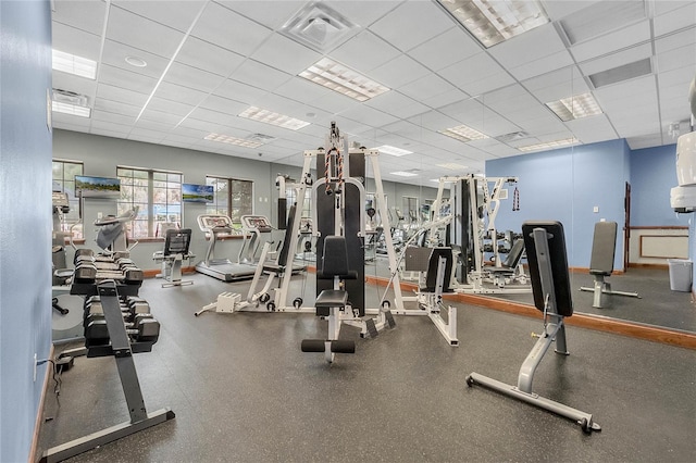 gym featuring a paneled ceiling