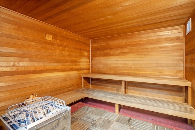 view of sauna with wooden walls and wood ceiling