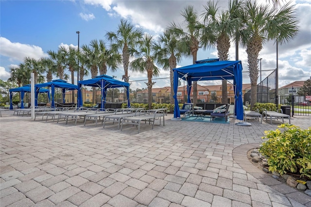 surrounding community with a gazebo and a patio