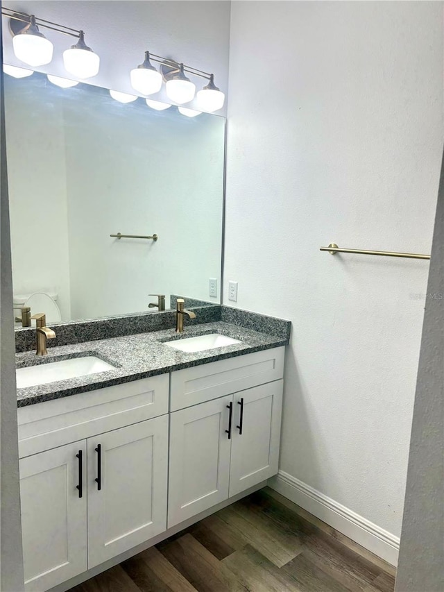 bathroom featuring vanity and hardwood / wood-style floors