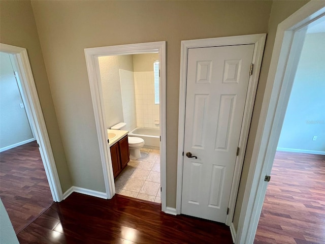 hall with dark hardwood / wood-style floors