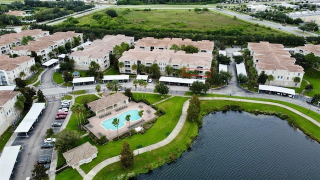 birds eye view of property with a water view