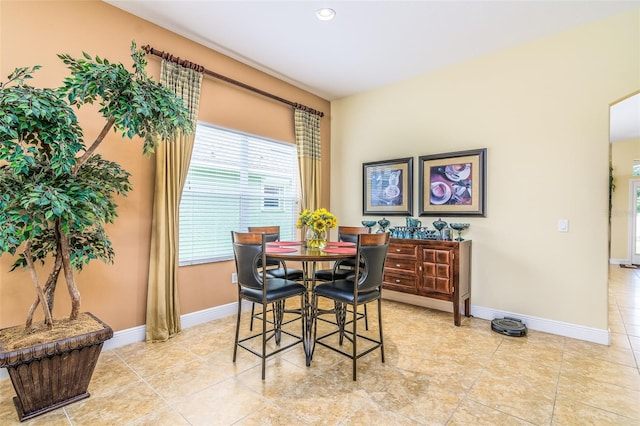 dining area featuring light tile patterned floors