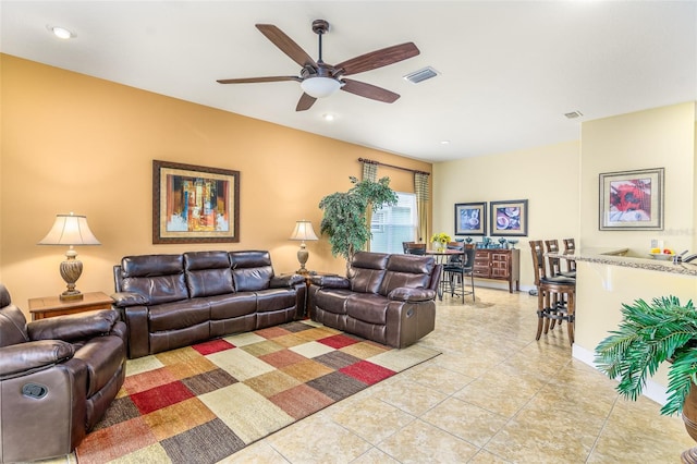 tiled living room featuring ceiling fan