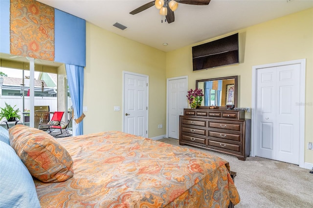 carpeted bedroom with ceiling fan and access to exterior