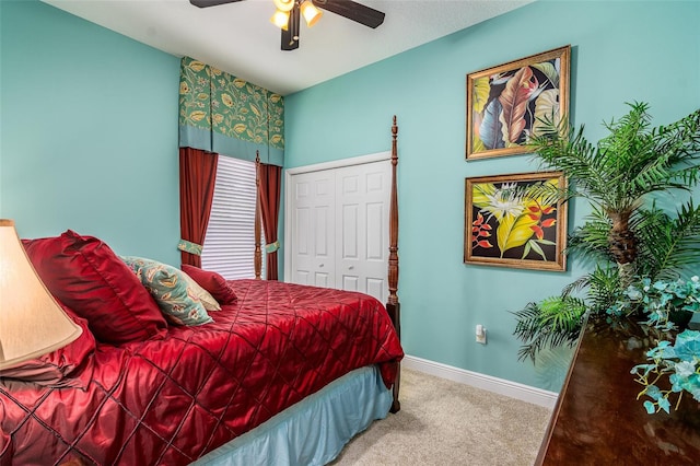 bedroom with carpet floors, a closet, and ceiling fan