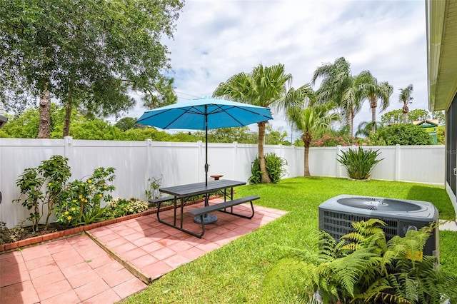 view of yard featuring a patio and central AC unit