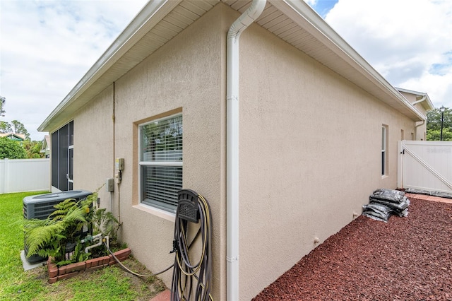 view of side of property with cooling unit