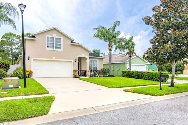 view of front of house with a front yard and a garage