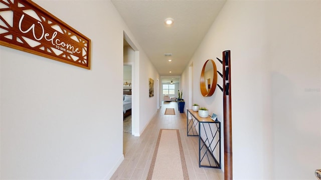 hallway with light wood-type flooring