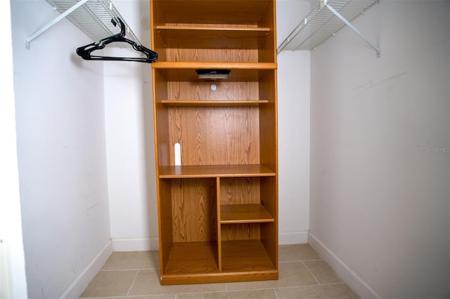 walk in closet featuring tile patterned flooring